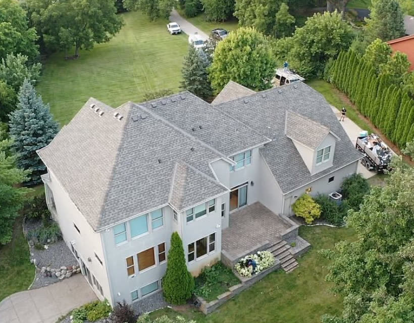 A large Twin Cities home seen from above with a new Stoneridge roof